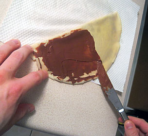 Spreading Nutella on a Crepe