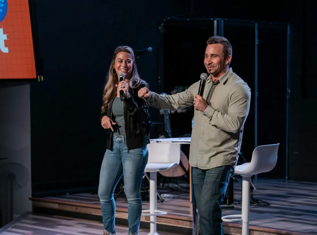 The Worleys of Spark Discipleship speaking on stage